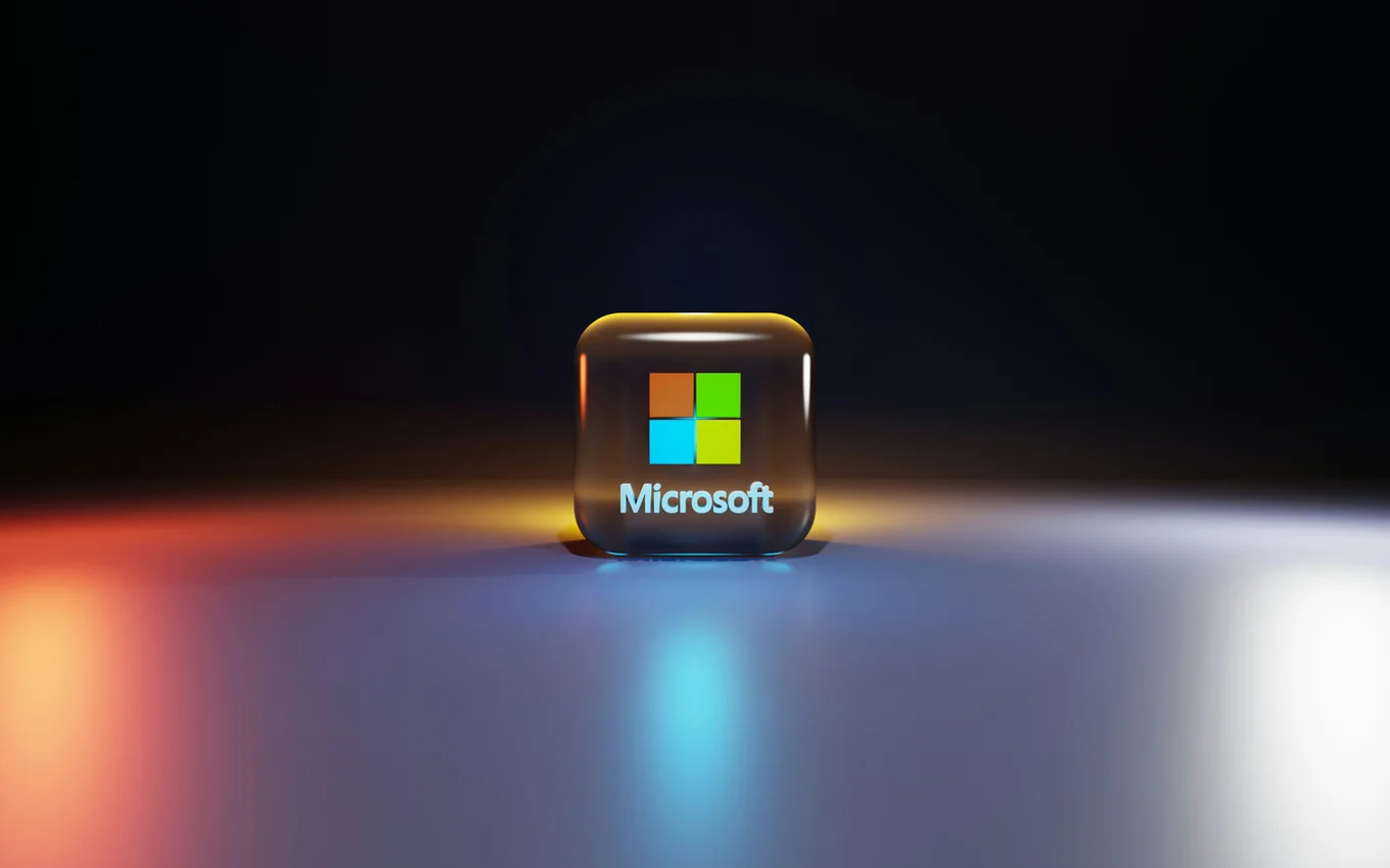 Microsoft logo on a glossy square with colored lights.